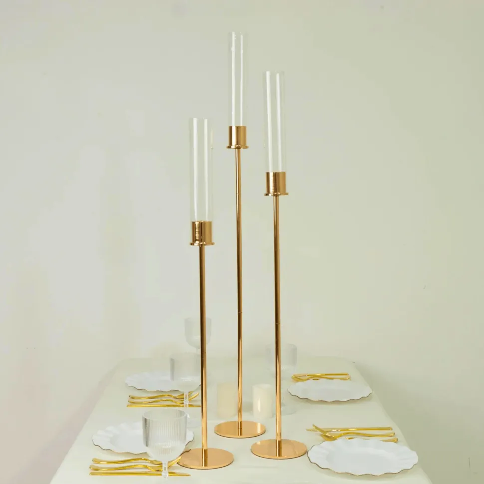 Set of 3 Gold Metal Taper Candle Holders with Hurricane Glass Shades (28in, 32in & 36in Height)